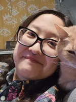 Jei Lee-Cullin and their cat Harley